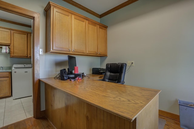 tiled office featuring crown molding and washer / dryer