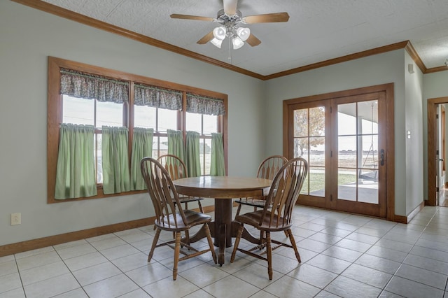 dining area featuring ornamental molding, a healthy amount of sunlight, light tile patterned floors, and ceiling fan