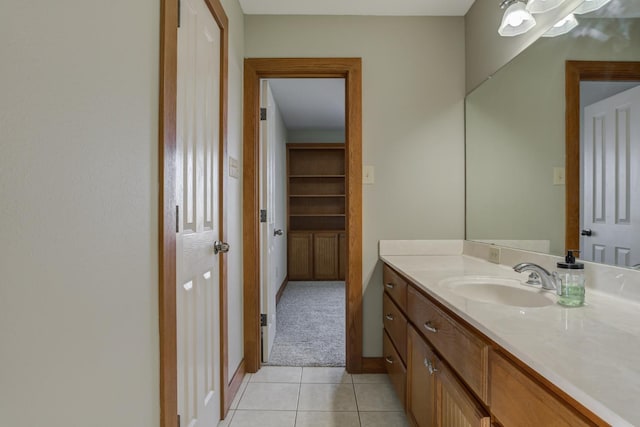 bathroom featuring tile patterned flooring and vanity