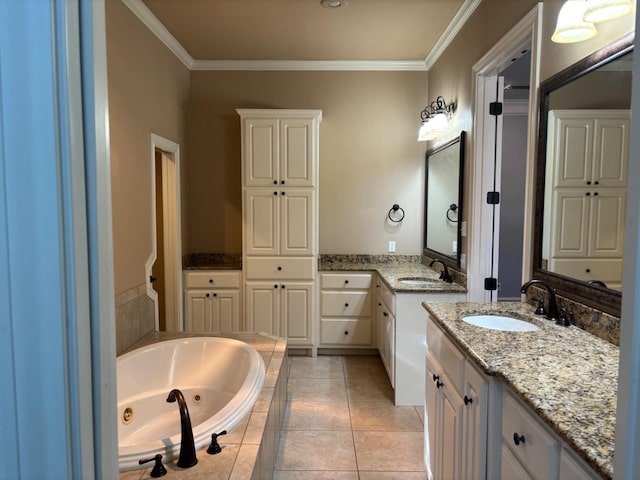 bathroom featuring tile patterned floors, ornamental molding, vanity, and tiled tub