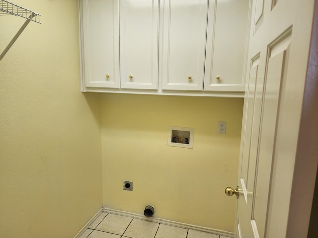 washroom with cabinet space, baseboards, tile patterned floors, washer hookup, and electric dryer hookup