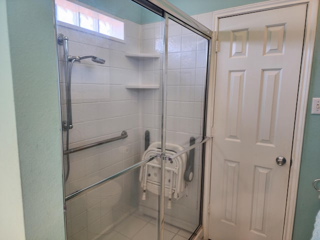 full bath with a shower stall