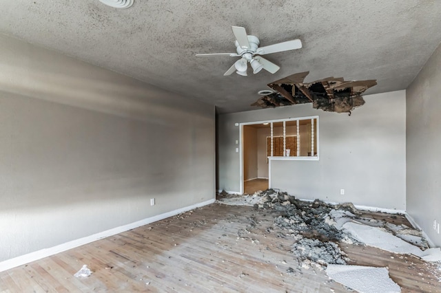 interior space featuring hardwood / wood-style floors and ceiling fan