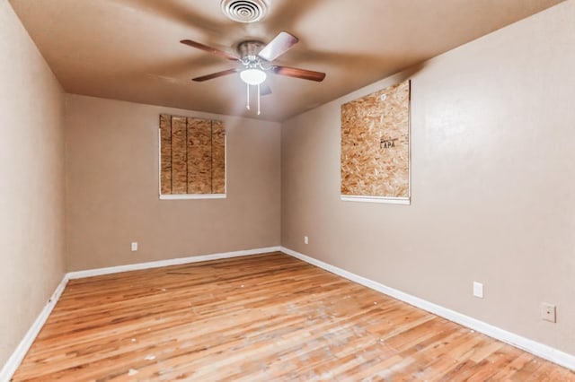 spare room featuring ceiling fan and light wood-type flooring