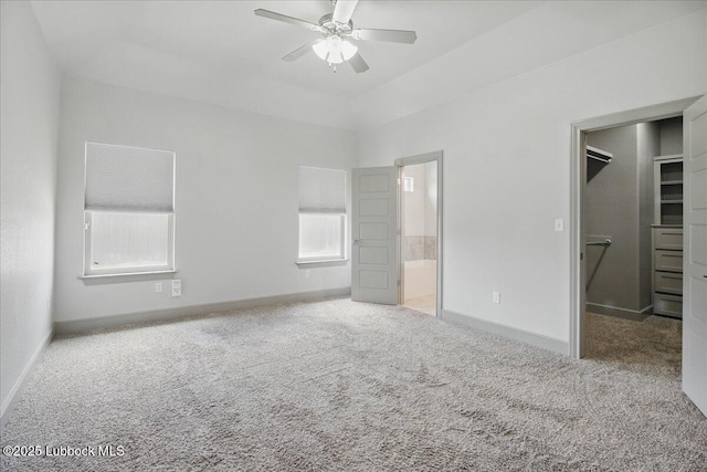 10330 Ave X Ave, Lubbock, TX 79423 - unfurnished bedroom with a spacious closet, carpet floors, ensuite bath, and a ceiling fan