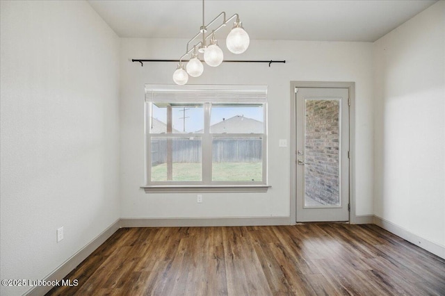 10330 Ave X Ave, Lubbock, TX 79423 - unfurnished dining area with a chandelier and wood finished floors