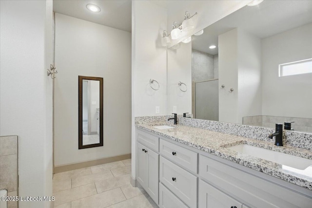 10330 Ave X Ave, Lubbock, TX 79423 - bathroom with double vanity, a walk in shower, and tile patterned floors