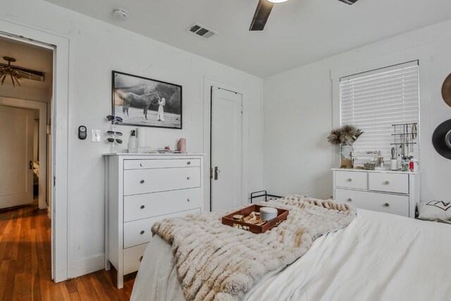 bedroom featuring hardwood / wood-style flooring and ceiling fan