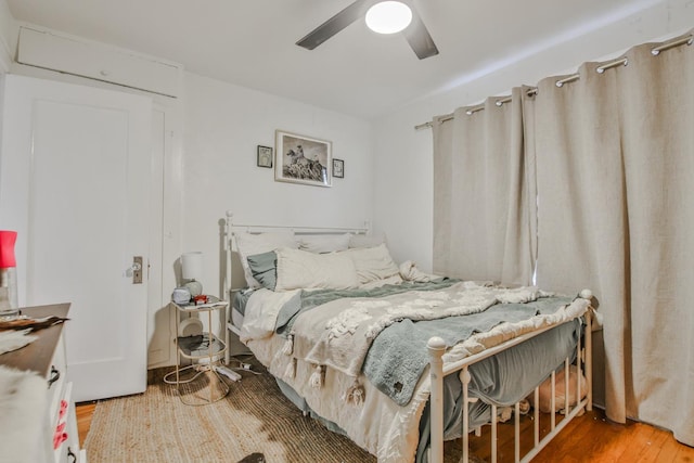 bedroom featuring wood-type flooring and ceiling fan