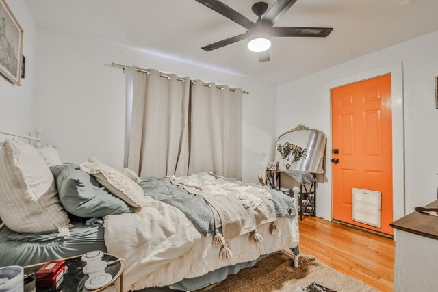 bedroom featuring hardwood / wood-style flooring and ceiling fan