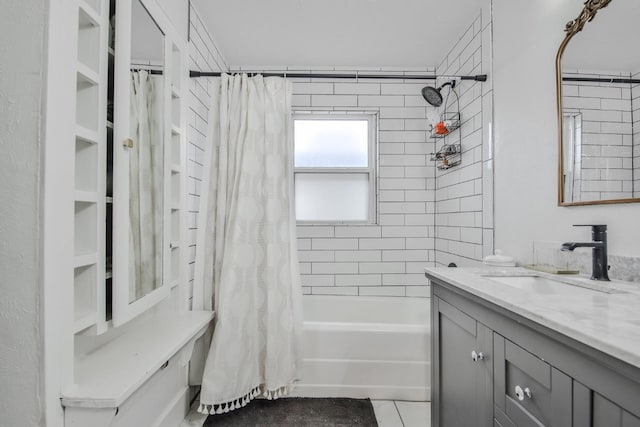 bathroom featuring vanity, tile patterned floors, and shower / bath combo with shower curtain