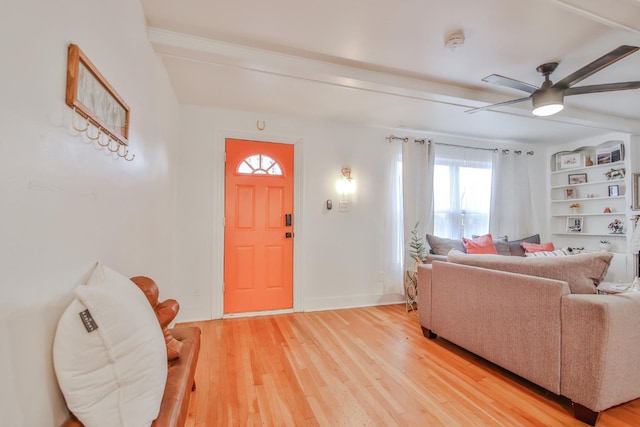 living room featuring ceiling fan and wood-type flooring