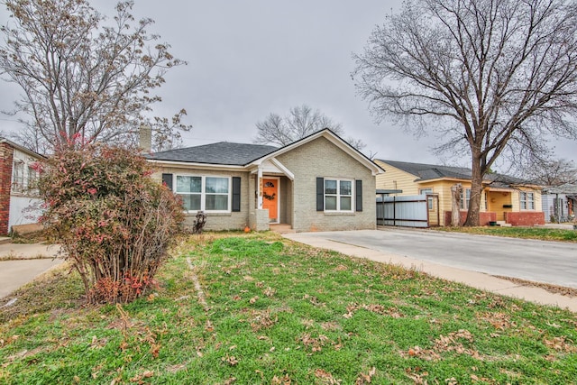 ranch-style home with a front lawn