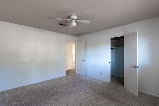 unfurnished bedroom featuring ceiling fan, carpet floors, and a closet