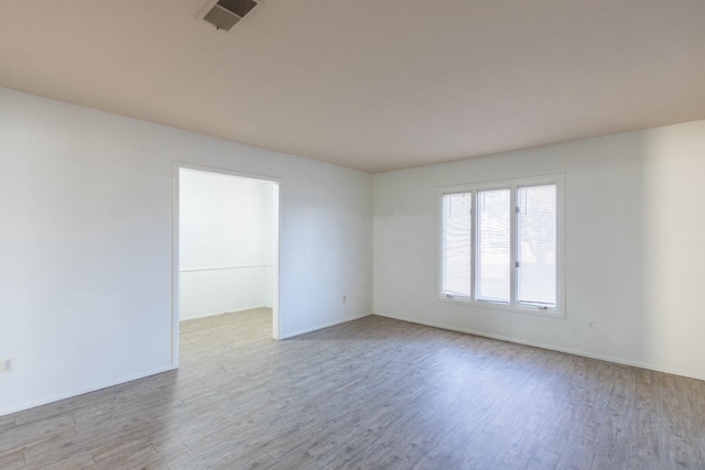 empty room with light wood-type flooring