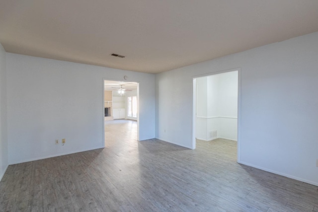 empty room with hardwood / wood-style floors