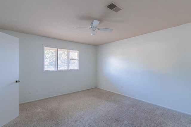 empty room featuring carpet and ceiling fan