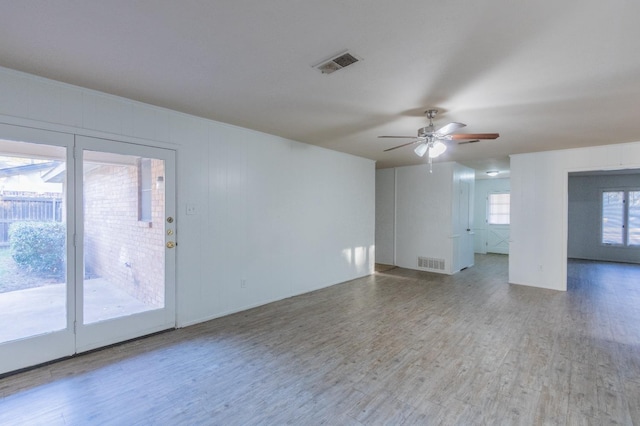 unfurnished room featuring hardwood / wood-style floors and ceiling fan