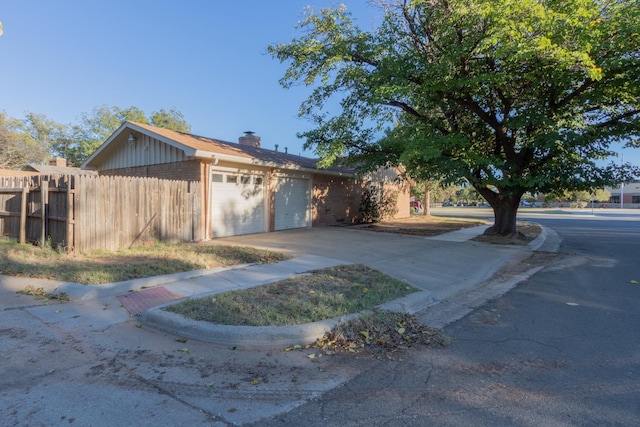 single story home with a garage