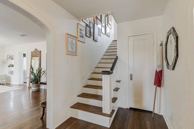 3003 19th St, Lubbock, TX 79410 - staircase featuring arched walkways and wood finished floors