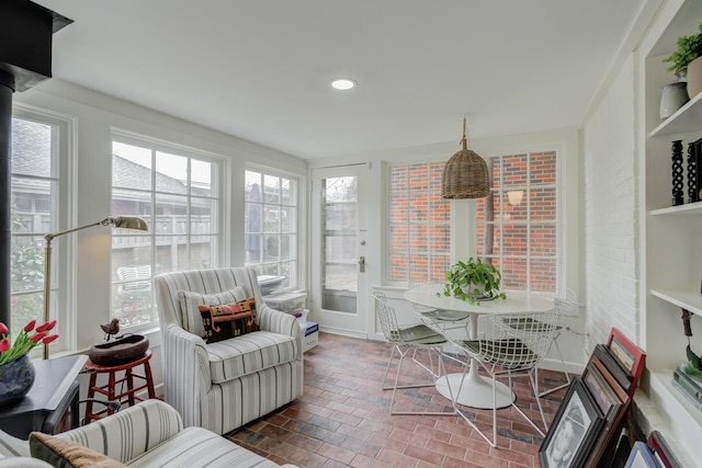 3003 19th St, Lubbock, TX 79410 - sunroom with brick patterned flooring and recessed lighting