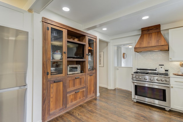 3003 19th St, Lubbock, TX 79410 - kitchen with appliances with stainless steel finishes, custom exhaust hood, tasteful backsplash, dark wood-style floors, and recessed lighting