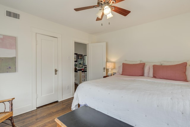 3003 19th St, Lubbock, TX 79410 - bedroom featuring dark wood finished floors and a ceiling fan