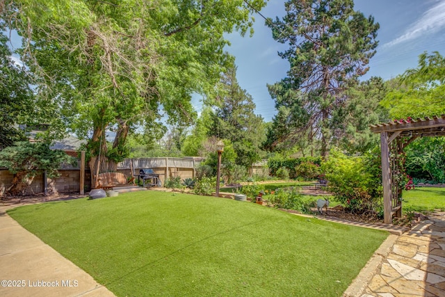 3003 19th St, Lubbock, TX 79410 - fenced backyard with a pergola