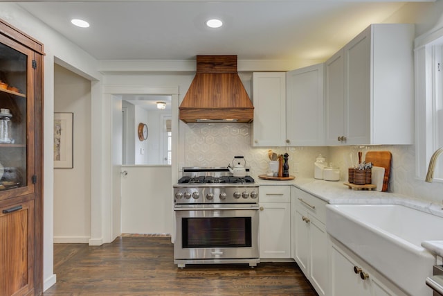 3003 19th St, Lubbock, TX 79410 - kitchen with premium range hood, high end stove, decorative backsplash, dark wood-type flooring, and recessed lighting