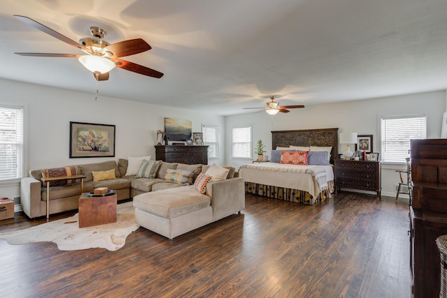 3003 19th St, Lubbock, TX 79410 - bedroom with multiple windows, dark wood finished floors, and ceiling fan