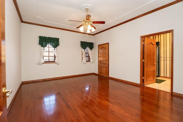 spare room featuring crown molding, light hardwood / wood-style floors, and ceiling fan