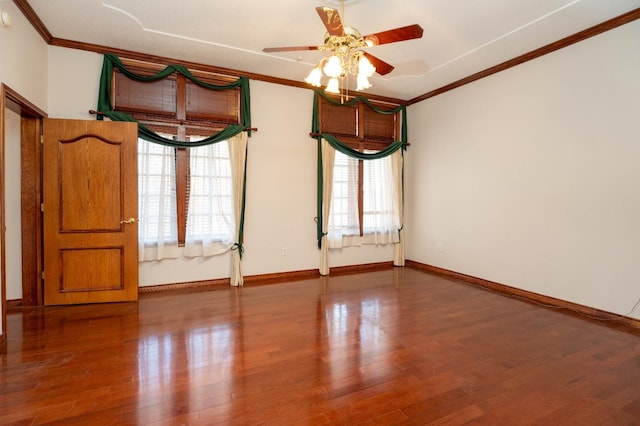 empty room featuring crown molding, wood-type flooring, and ceiling fan