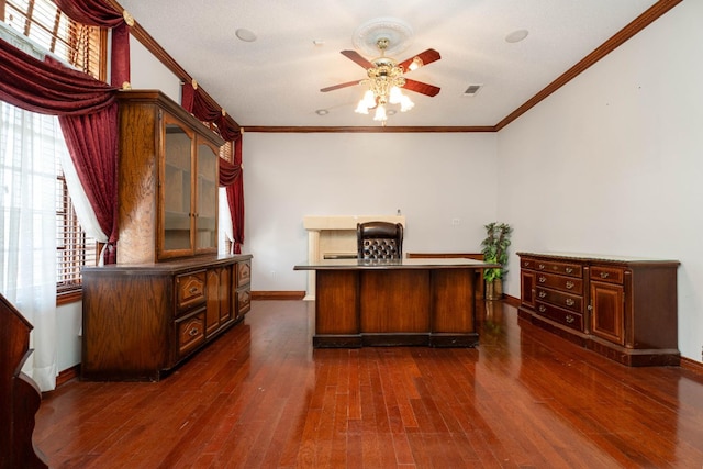 unfurnished office with ceiling fan, ornamental molding, and dark hardwood / wood-style floors