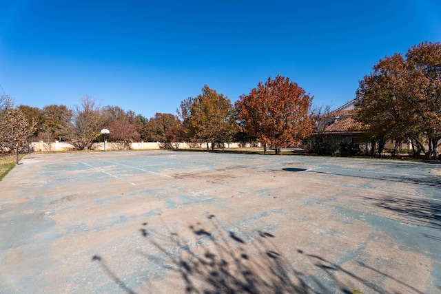 view of yard featuring basketball court