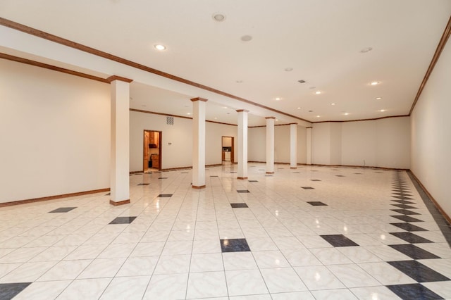 tiled empty room featuring crown molding and ornate columns