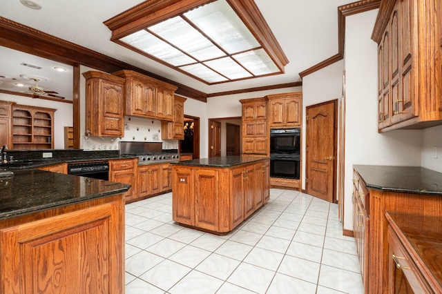 kitchen featuring sink, crown molding, black appliances, and a center island