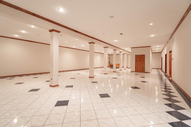 basement featuring light tile patterned floors and crown molding