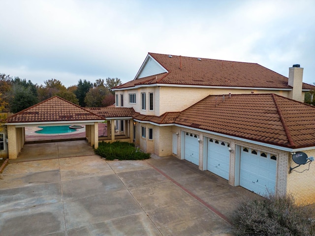 view of side of property with a garage