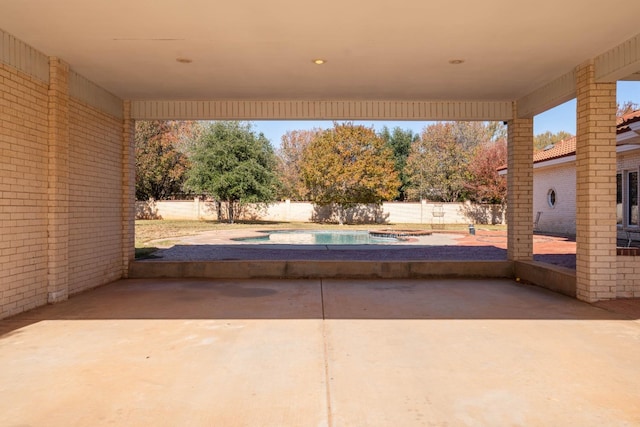 view of patio with a fenced in pool