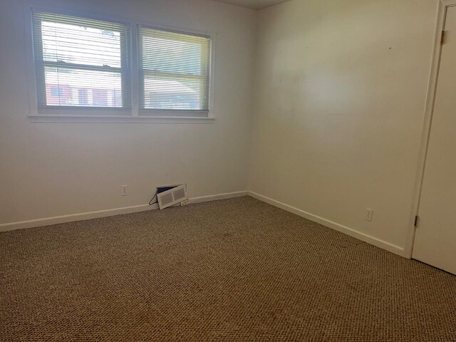 unfurnished room featuring carpet floors