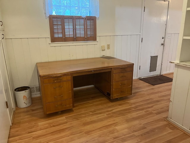 unfurnished office with light hardwood / wood-style floors