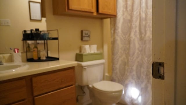 full bathroom with vanity, toilet, and shower / bath combo with shower curtain