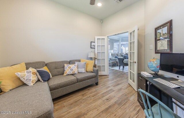 5004 County Rd 1430, Lubbock, TX 79407 - living area with french doors, light wood-style flooring, and a ceiling fan