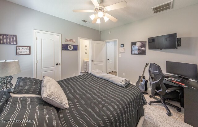 5004 County Rd 1430, Lubbock, TX 79407 - carpeted bedroom featuring a desk, baseboards, ceiling fan, and ensuite bathroom