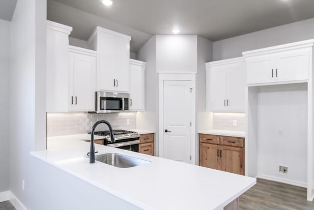 kitchen featuring white cabinetry and appliances with stainless steel finishes