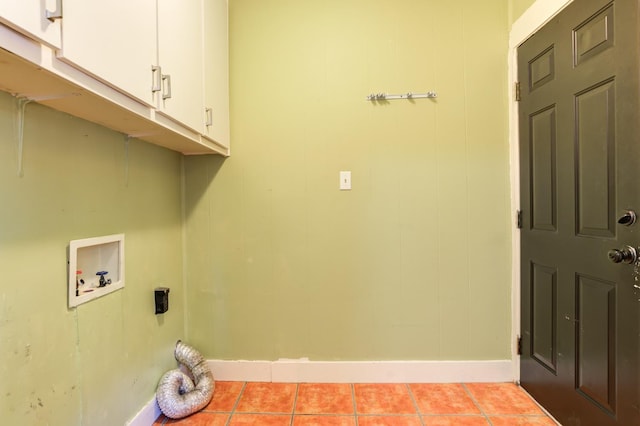 clothes washing area with cabinets, hookup for a washing machine, hookup for an electric dryer, and light tile patterned floors