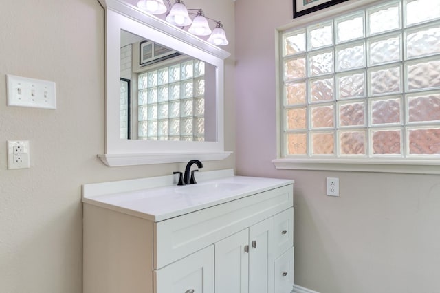 bathroom with vanity and a healthy amount of sunlight