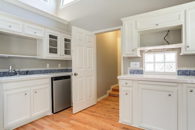 kitchen with sink, stainless steel dishwasher, and white cabinets