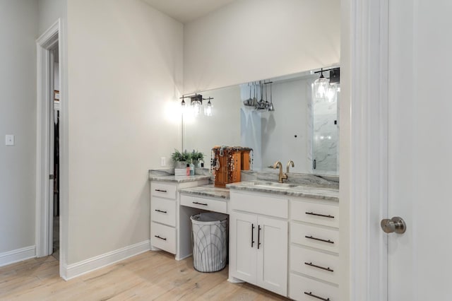 bathroom with wood-type flooring and vanity