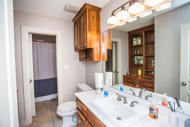 bathroom with walk in shower, tile patterned floors, toilet, and vanity